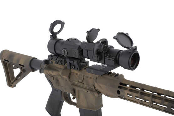 Close up of the SIG Sauer Juliet 3 magnifier with quick release Power Cam mount behind a 30mm red dot scope